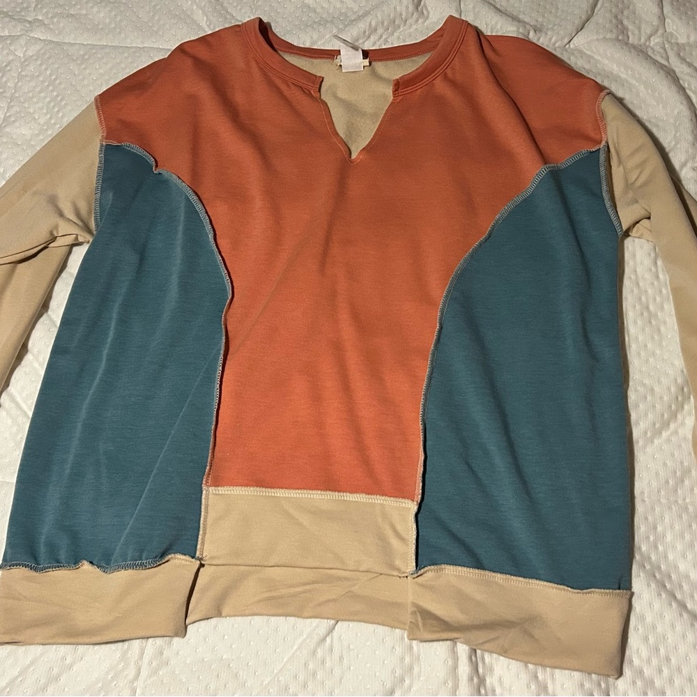 Bibi cream, teal and orange sweatshirt.